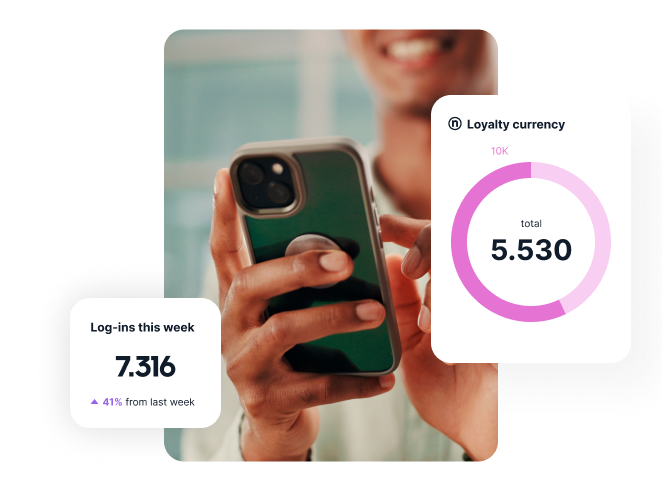 A person holding a smartphone showing loyalty currency data and weekly login statistics on the screen