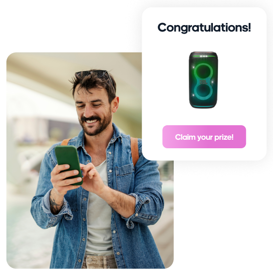 Man on phone winning a coupon for a speaker reward.